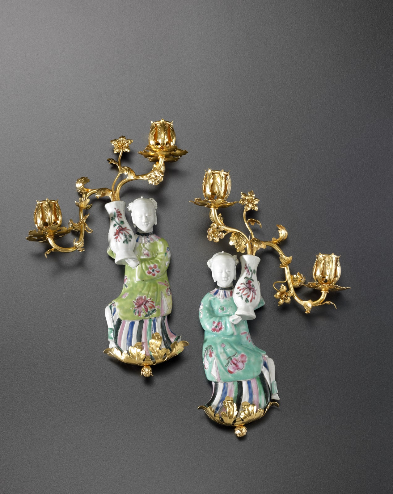 Unknown, A pair of Louis XV two-light wall-lights, The porcelain figurines: China, probably Jingdezhen, Qing Dynasty, late Kangxi period (1662-1722). The gilt bronzes: Paris, date circa 1750
