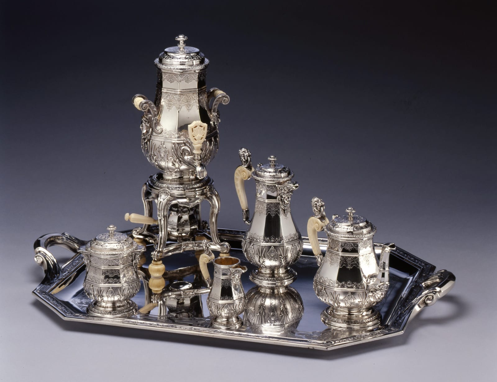Edmond Tétard, An Eclectic style five piece tea and coffee-service with matching water urn and tray by Edmond Tétard, Paris, dated 1885