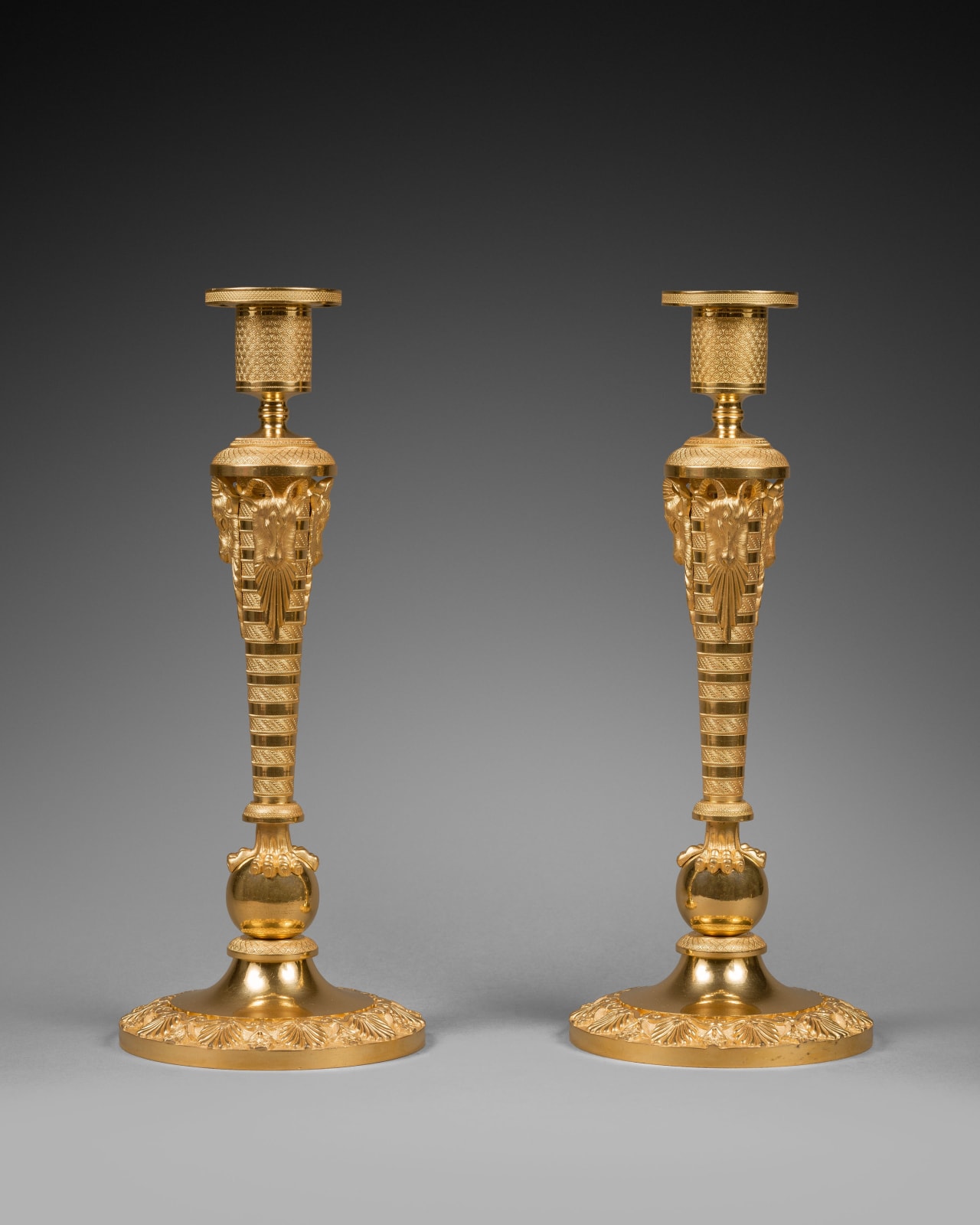 Unknown, A pair of large Russian Empire gilt bronze candlesticks, Moscow, date 1810-20 circa