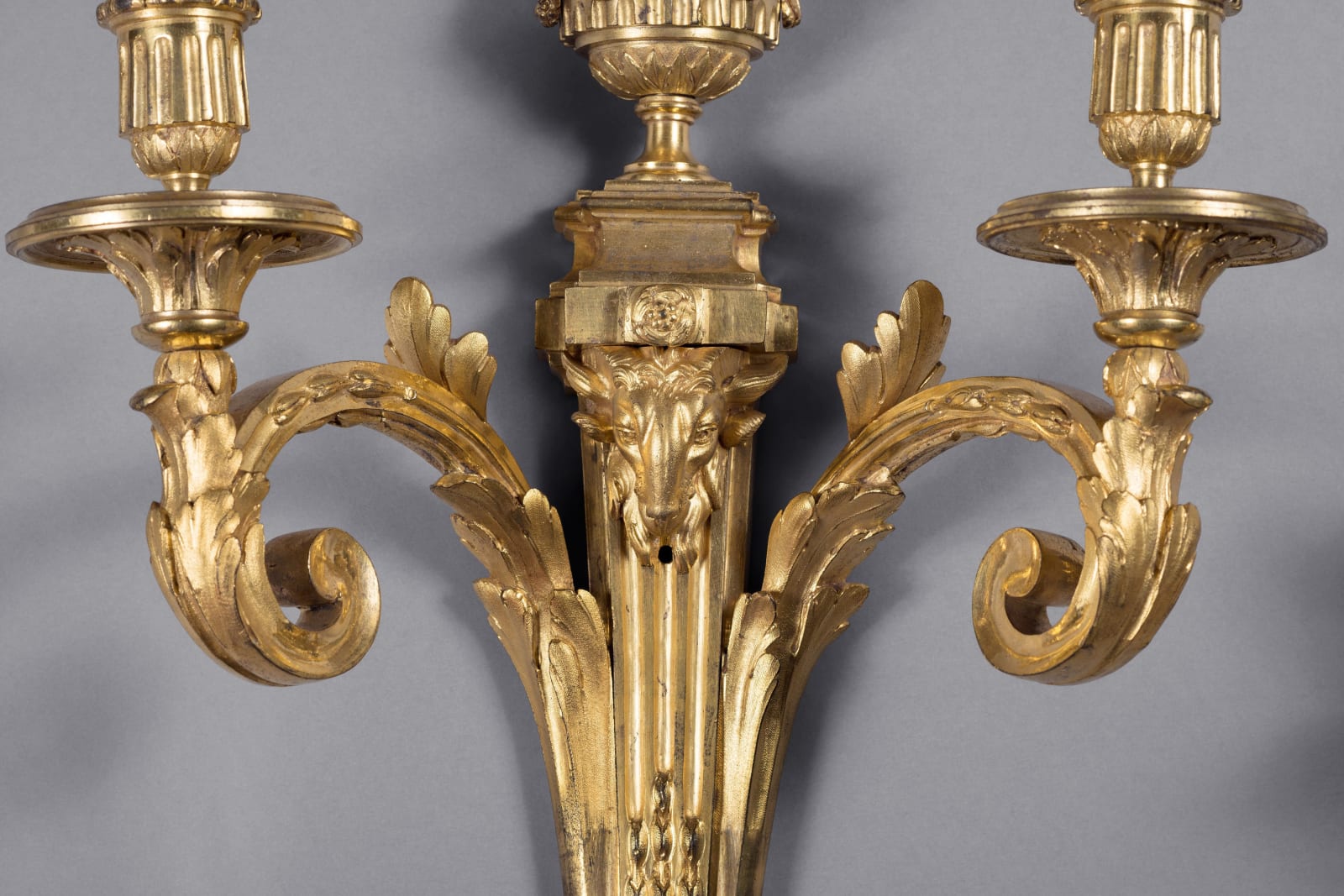 Jean-Charles Delafosse (in the style of), A pair of Louis XVI two-light wall-lights in the style of Jean-Charles Delafosse, Paris, date circa 1770