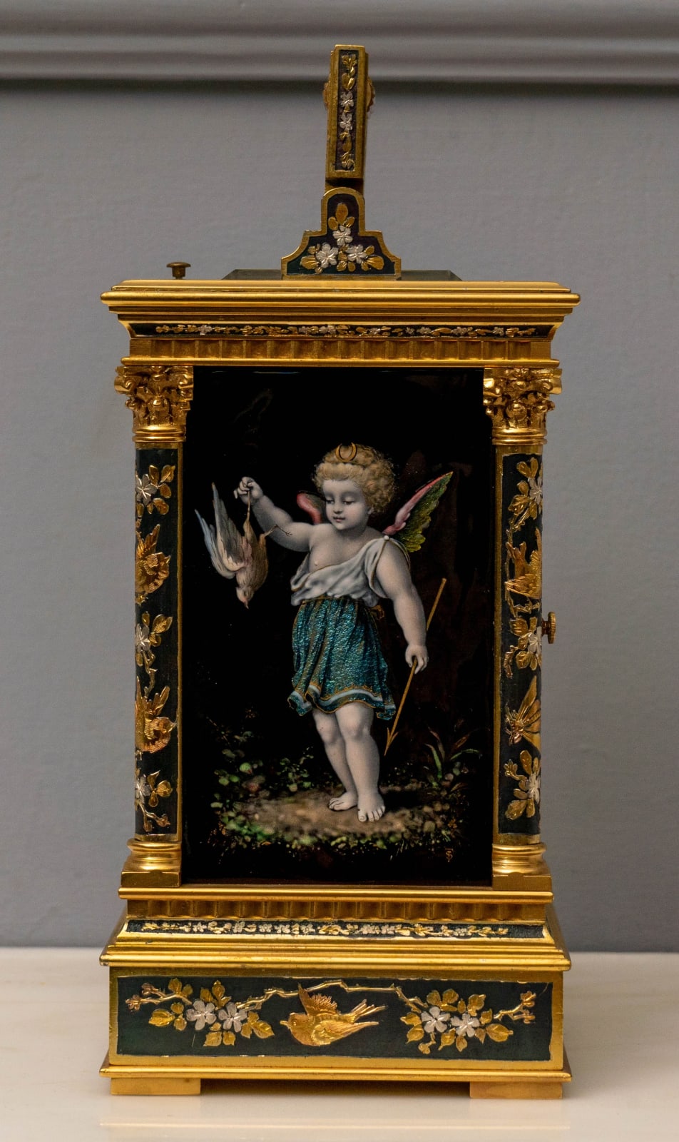 A LATE NINETEENTH CENTURY FRENCH CARRIAGE CLOCK WITH GOLD, SILVER AND OTHER METALLIC RELIEF WORK AND ENAMEL PANELS, Paris, date circa 1810