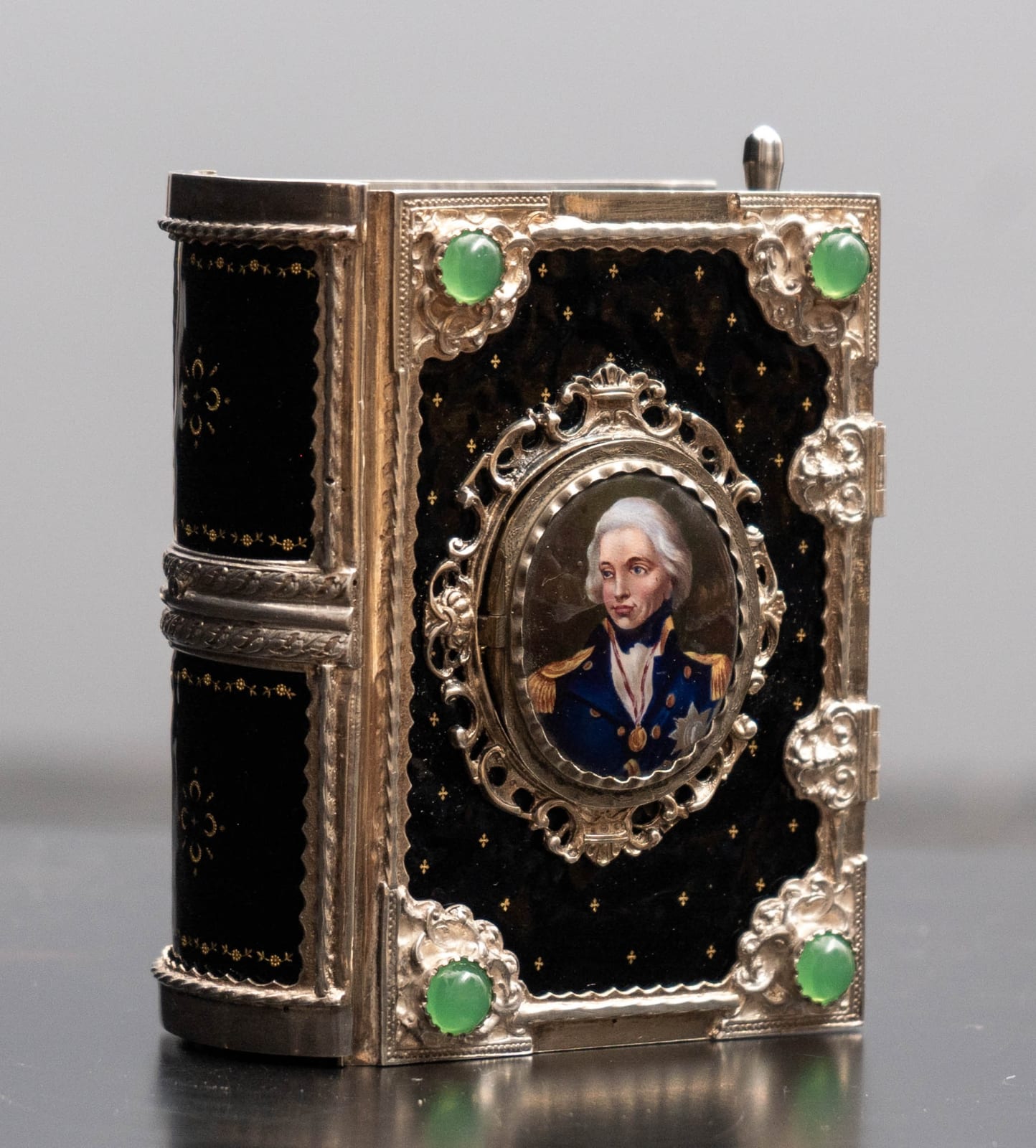 attributed to Karl Griesbaum, A GERMAN EARLY TWENTIETH CENTURY ENAMELLED SILVER SINGING BIRD BOX IN THE FORM OF A BOOK, The Black Forest, Germany, date circa 1925-35