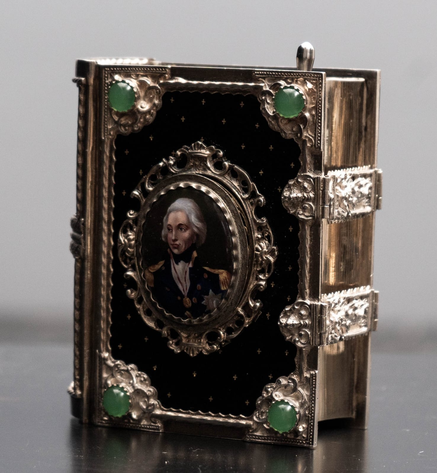 attributed to Karl Griesbaum, A GERMAN EARLY TWENTIETH CENTURY ENAMELLED SILVER SINGING BIRD BOX IN THE FORM OF A BOOK, The Black Forest, Germany, date circa 1925-35