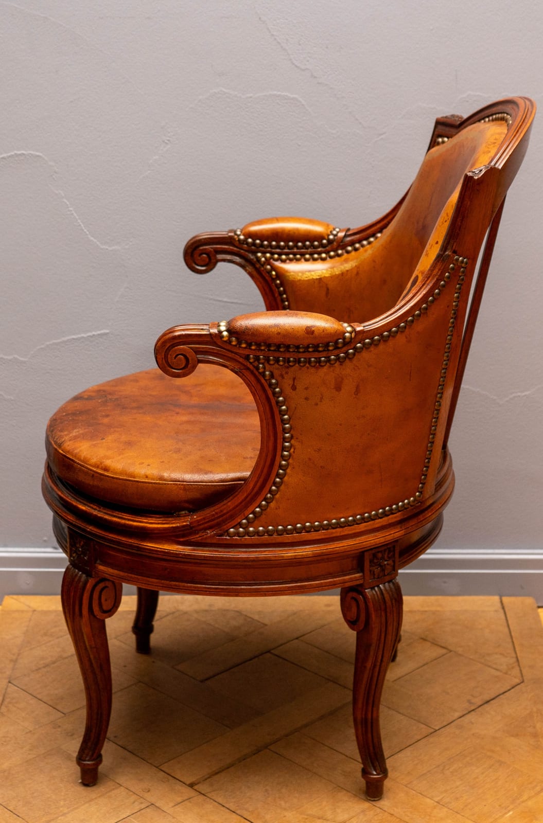 attributed to Georges Jacob, A LOUIS XVI ROSEWOOD AND LEATHER UPHOLSTERED ROTATING FAUTEUIL DE BUREAU, Paris, date circa 1780