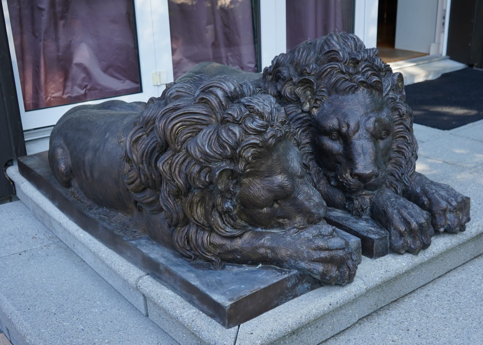 Antonio Canova, PAIR OF TWENTIETH CENTURY EUROPEAN PATINATED BRONZE RECUMBENT LIONS, Europe, either Paris or Rome, date circa 1900-70