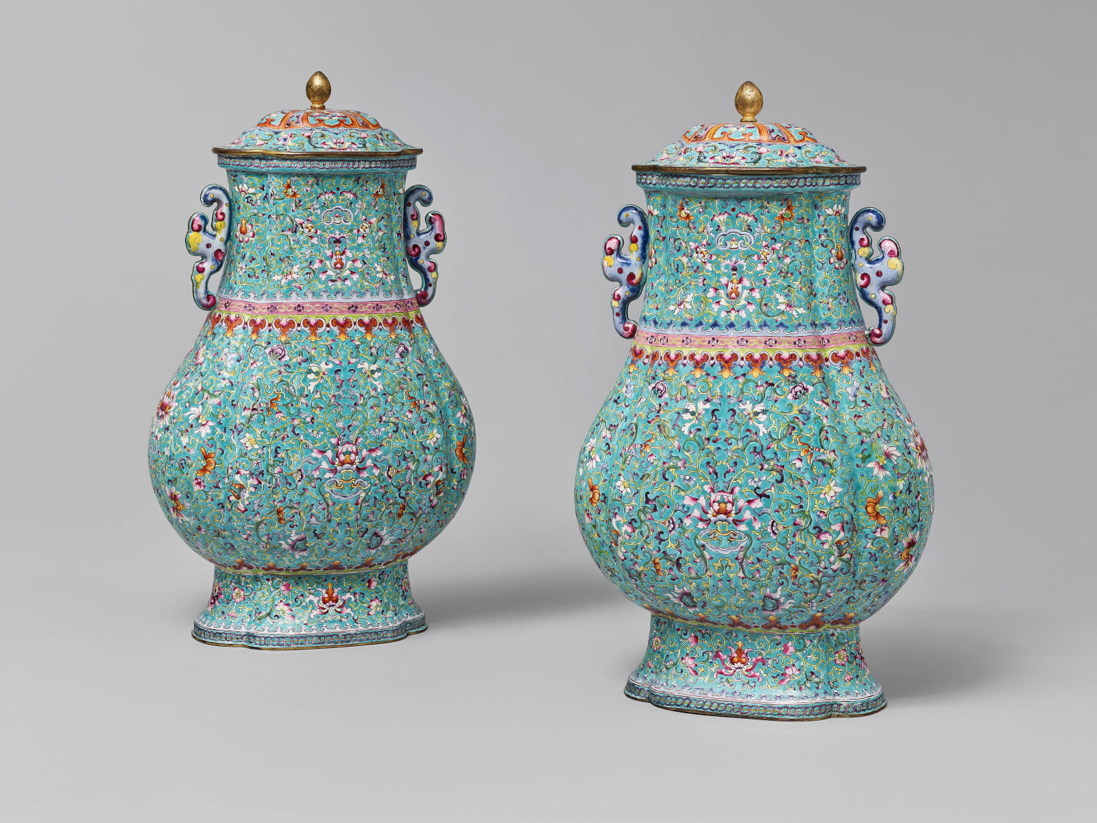 A PAIR OF CANTON ENAMEL HU-FORM VASES AND COVERS QIANLONG MARKS AND PERIOD, Chinese, circa 1750