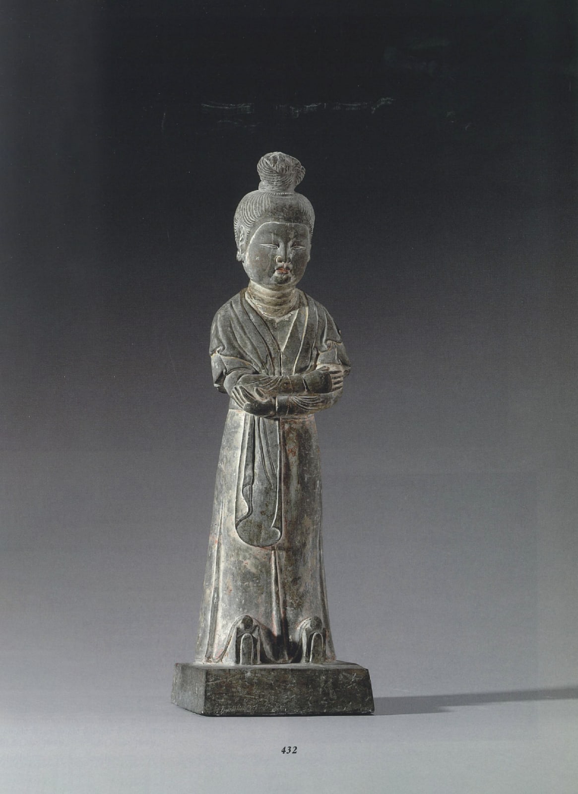 A LIMESTONE FIGURE OF AN ATTENDANT, CHINA, TANG DYNASTY (618 - 907), 7TH CENTURY