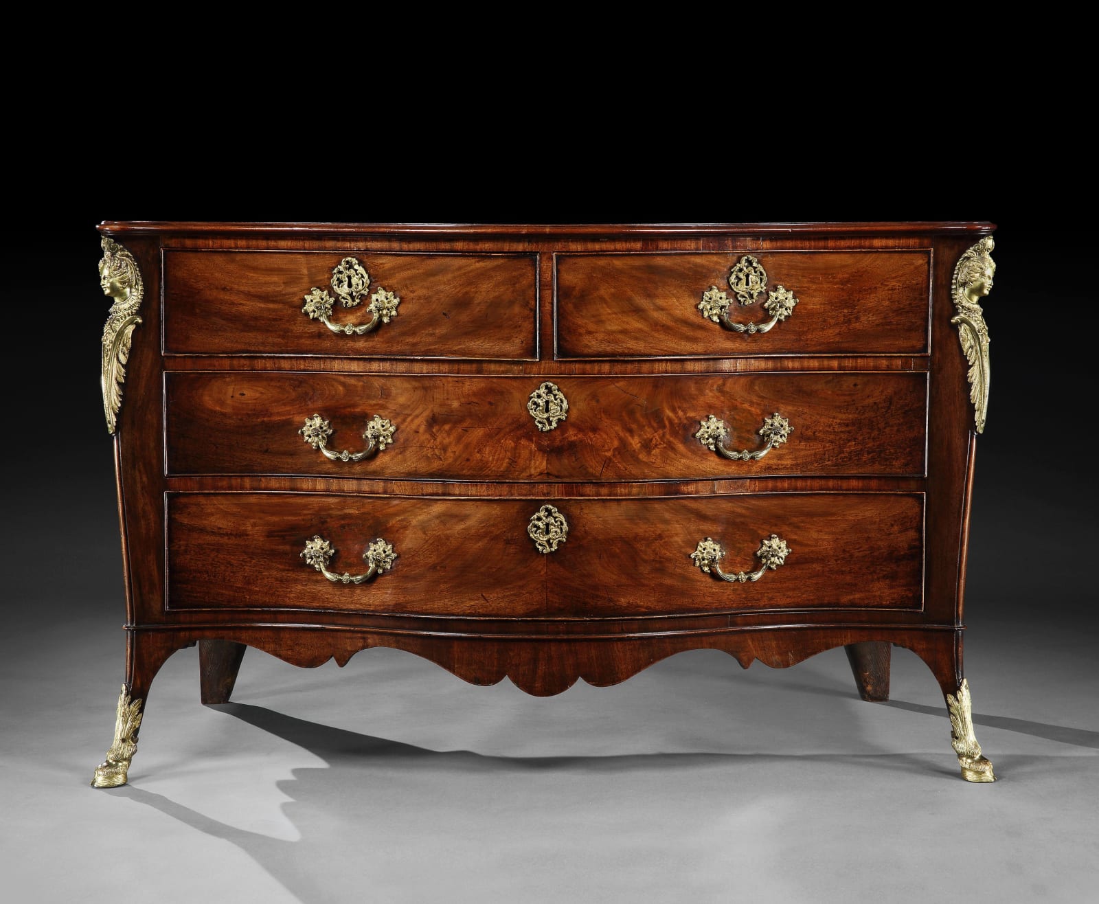 A GEORGE III MAHOGANY COMMODE ATTRIBUTED TO JOHN COBB, ENGLISH, CIRCA 1765