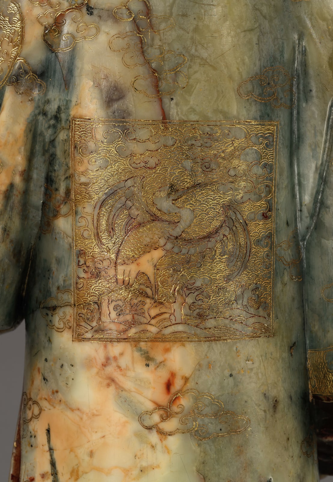 A PAIR OF CARVED SOAPSTONE FIGURES OF A MANDARIN AND FEMALE ATTENDANT, CHINESE, QING DYNASTY, KANGXI PERIOD (1662-1722)