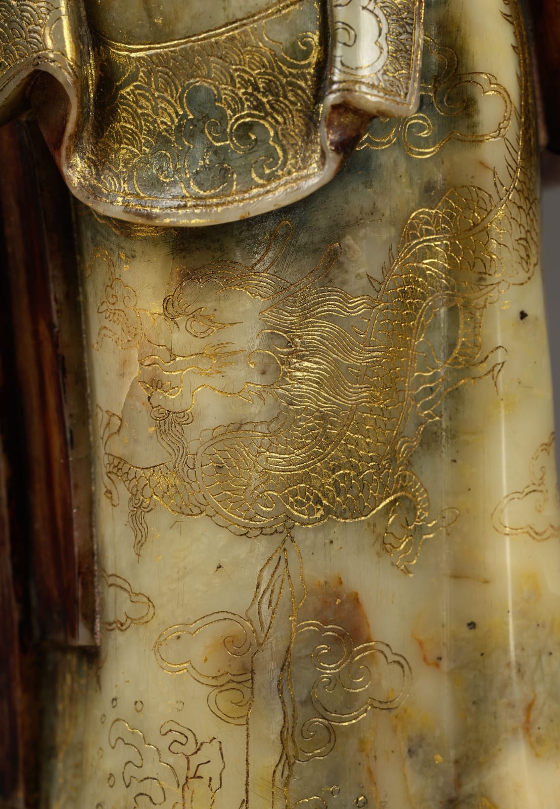 A PAIR OF CARVED SOAPSTONE FIGURES OF A MANDARIN AND FEMALE ATTENDANT, CHINESE, QING DYNASTY, KANGXI PERIOD (1662-1722)