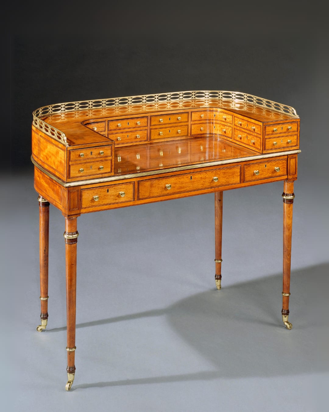 A GEORGE III SATINWOOD CARLTON HOUSE WRITING TABLE, English, circa 1790