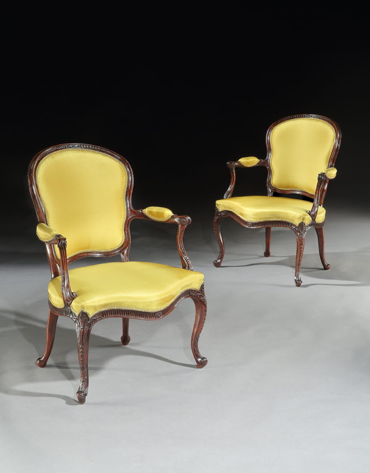 A PAIR OF GEORGE III MAHOGANY ARMCHAIRS, English, circa 1785