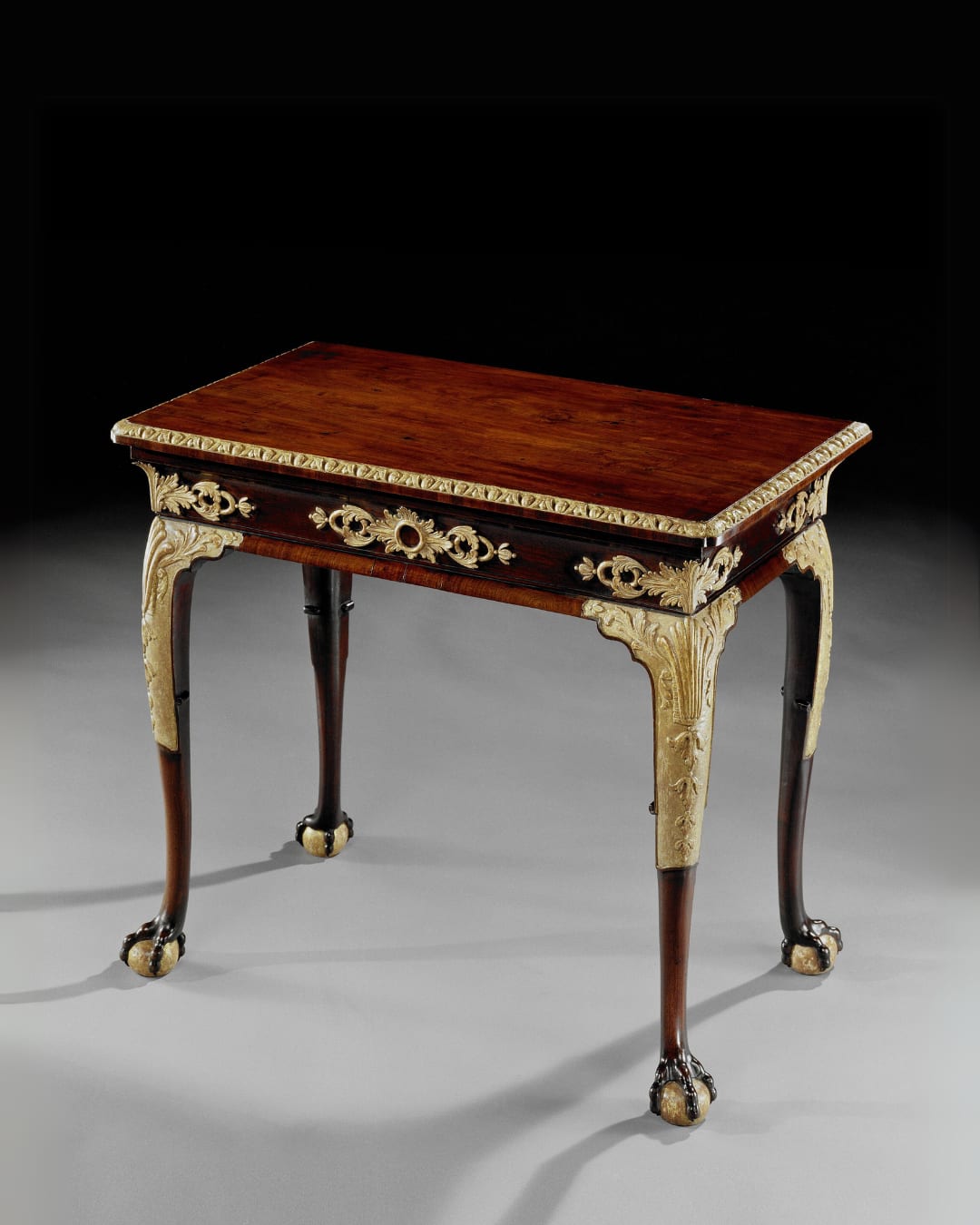 A GEORGE II PARCEL GILT MAHOGANY SIDE TABLE , English, circa 1740