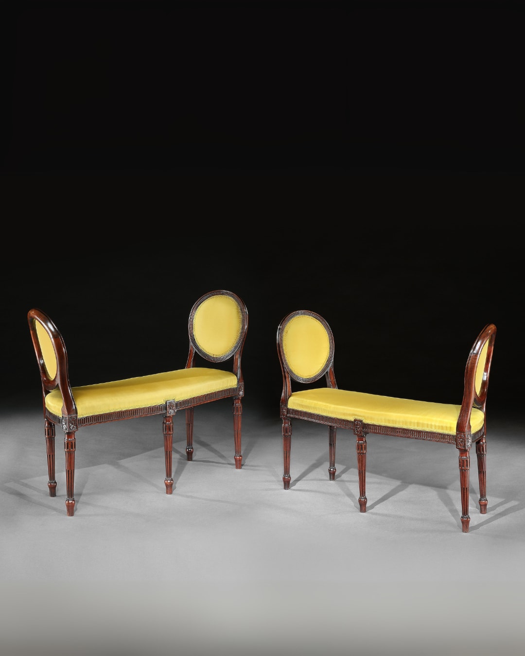 A PAIR OF GEORGE III MAHOGANY WINDOW SEATS, English, circa 1780