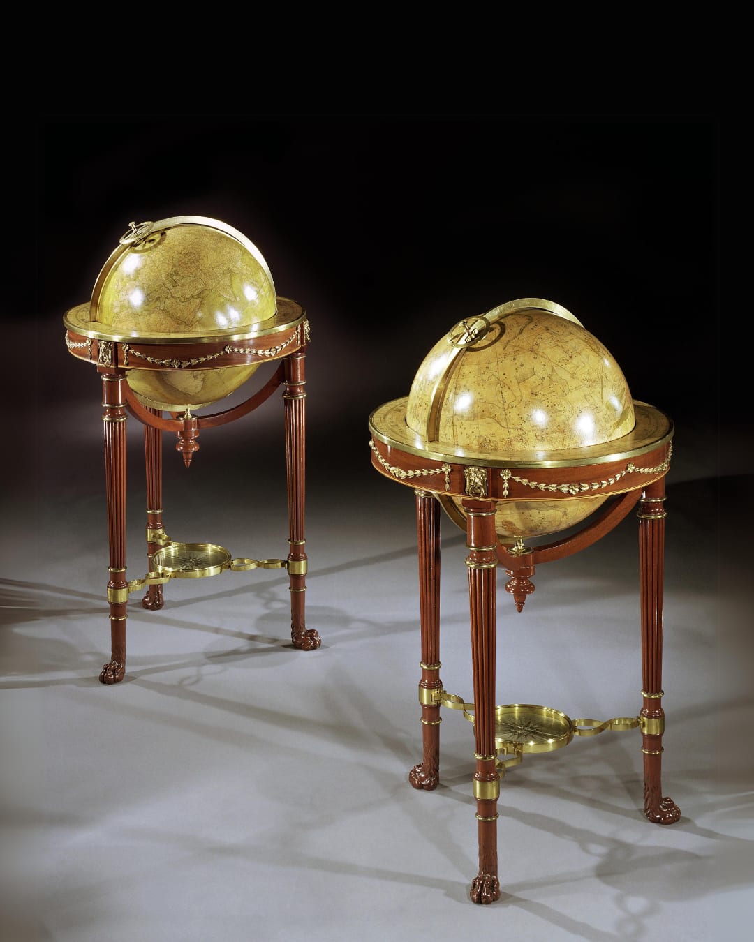 A PAIR OF ORMOLU MOUNTED MAHOGANY GLOBES, The terrestrial globe dated 1799  The celestial dated 1800