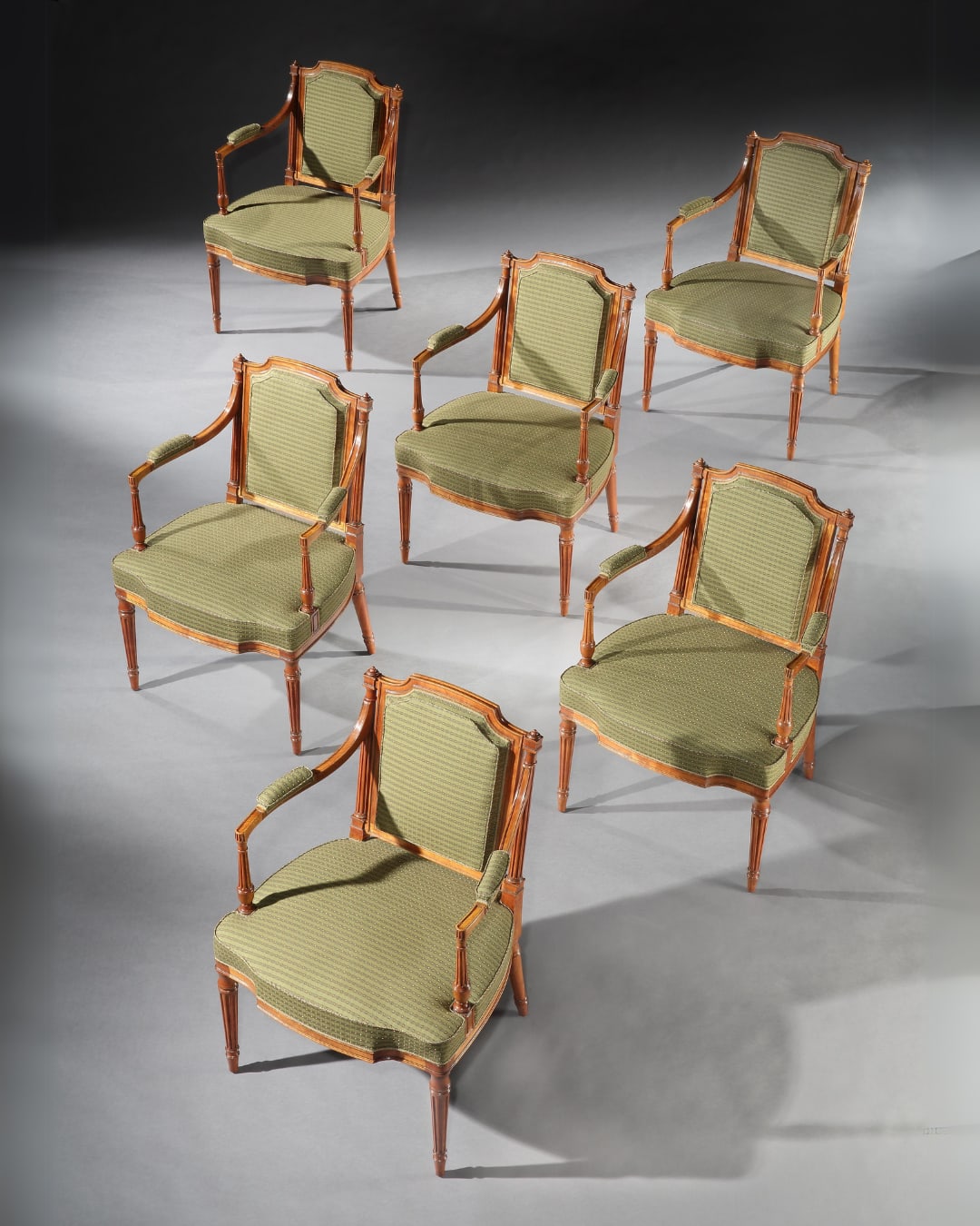 A SET OF SIX GEORGE III SATINWOOD ARMCHAIRS , English, circa 1785