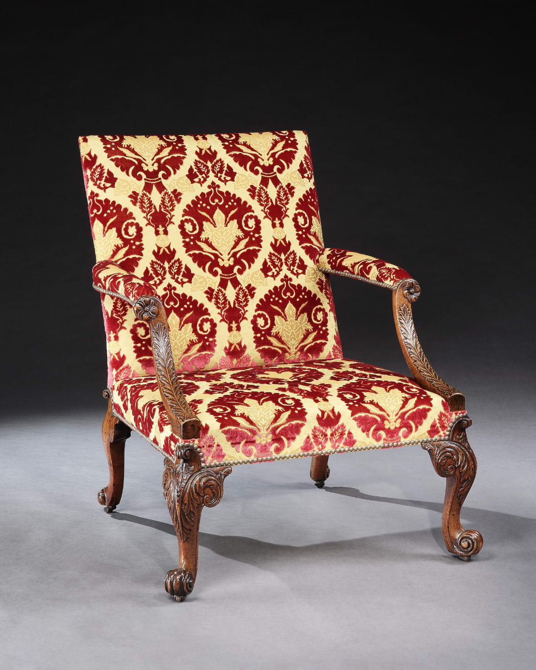 A GEORGE II WALNUT LIBRARY ARMCHAIR, English, circa 1745
