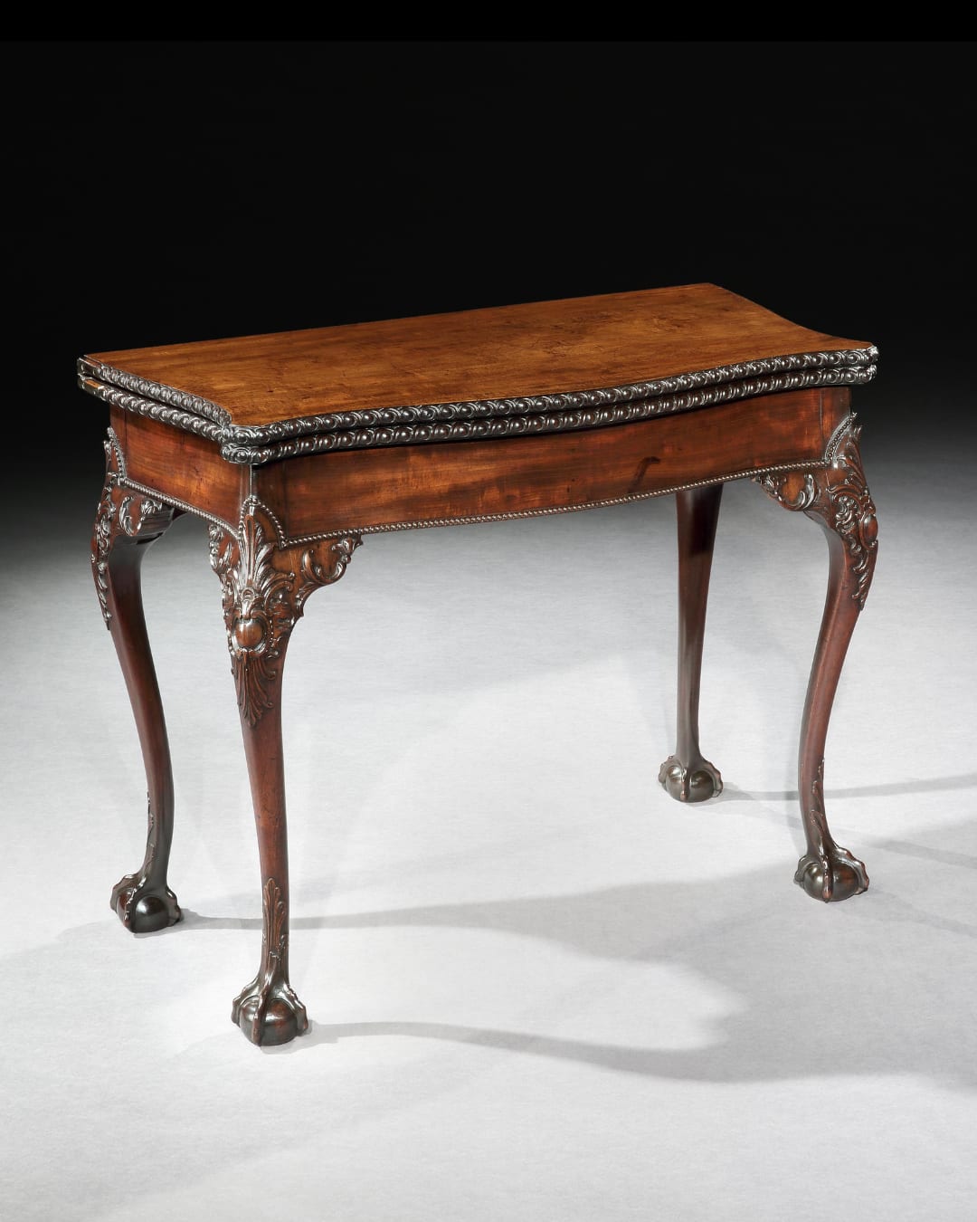 A GEORGE II MAHOGANY CARD TABLE, The table: English, circa 1755  The needlework: English, circa 1800