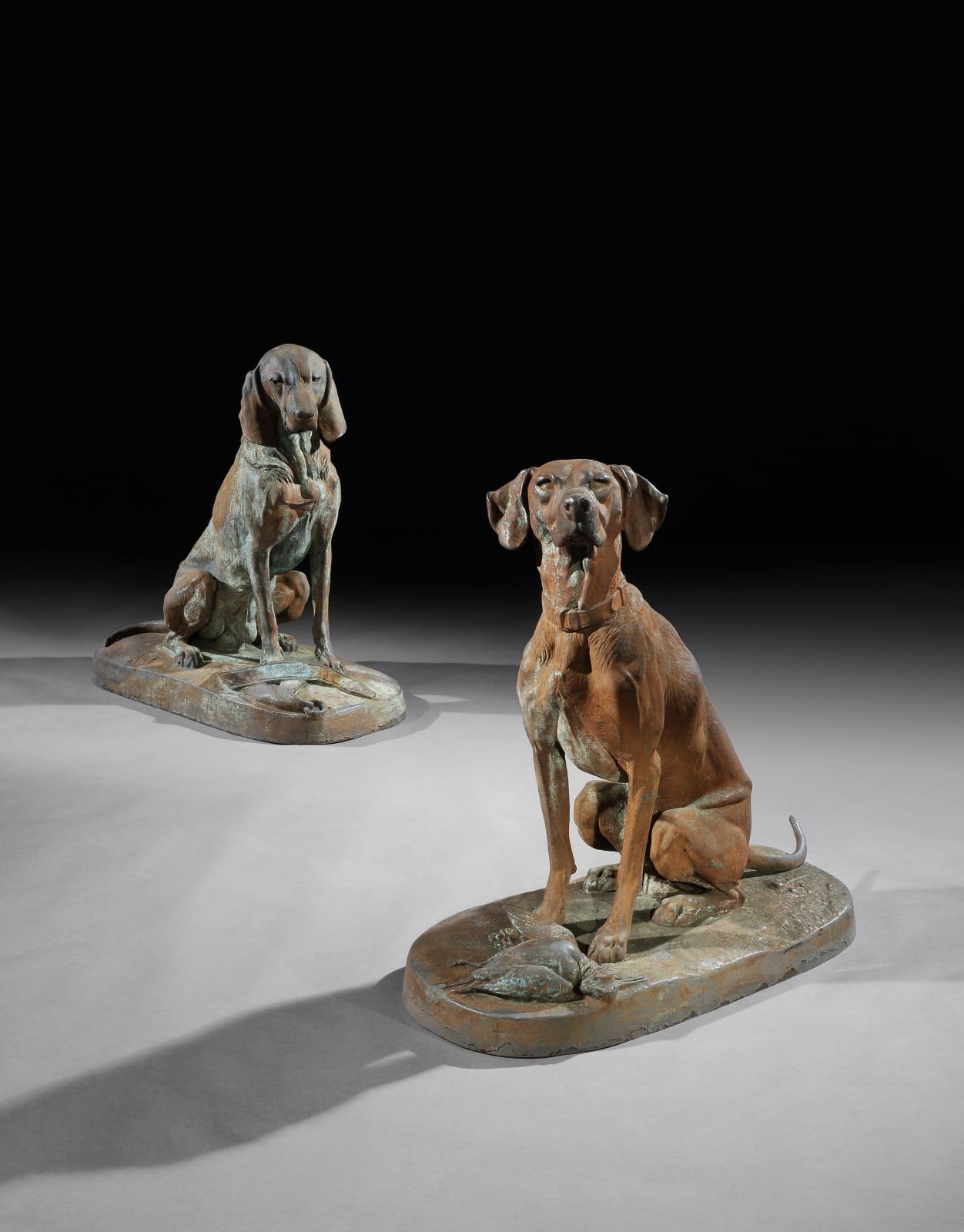 A PAIR OF SECOND EMPIRE CAST IRON SEATED HOUNDS , French, circa 1870