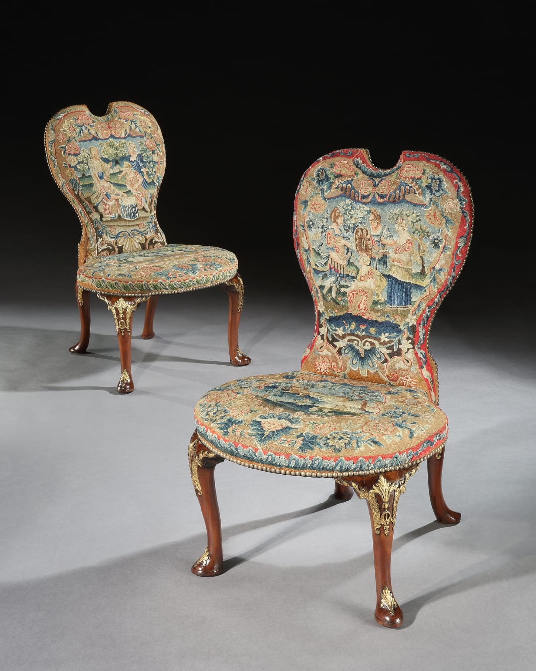 A PAIR OF GEORGE II CHAIRS ATTRIBUTED TO PETER ALEXANDER, The chairs: English, circa 1735  The needlework: English, circa 1735