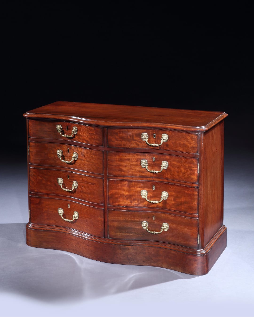 A GEORGE III MAHOGANY COMMODE, English, circa 1760