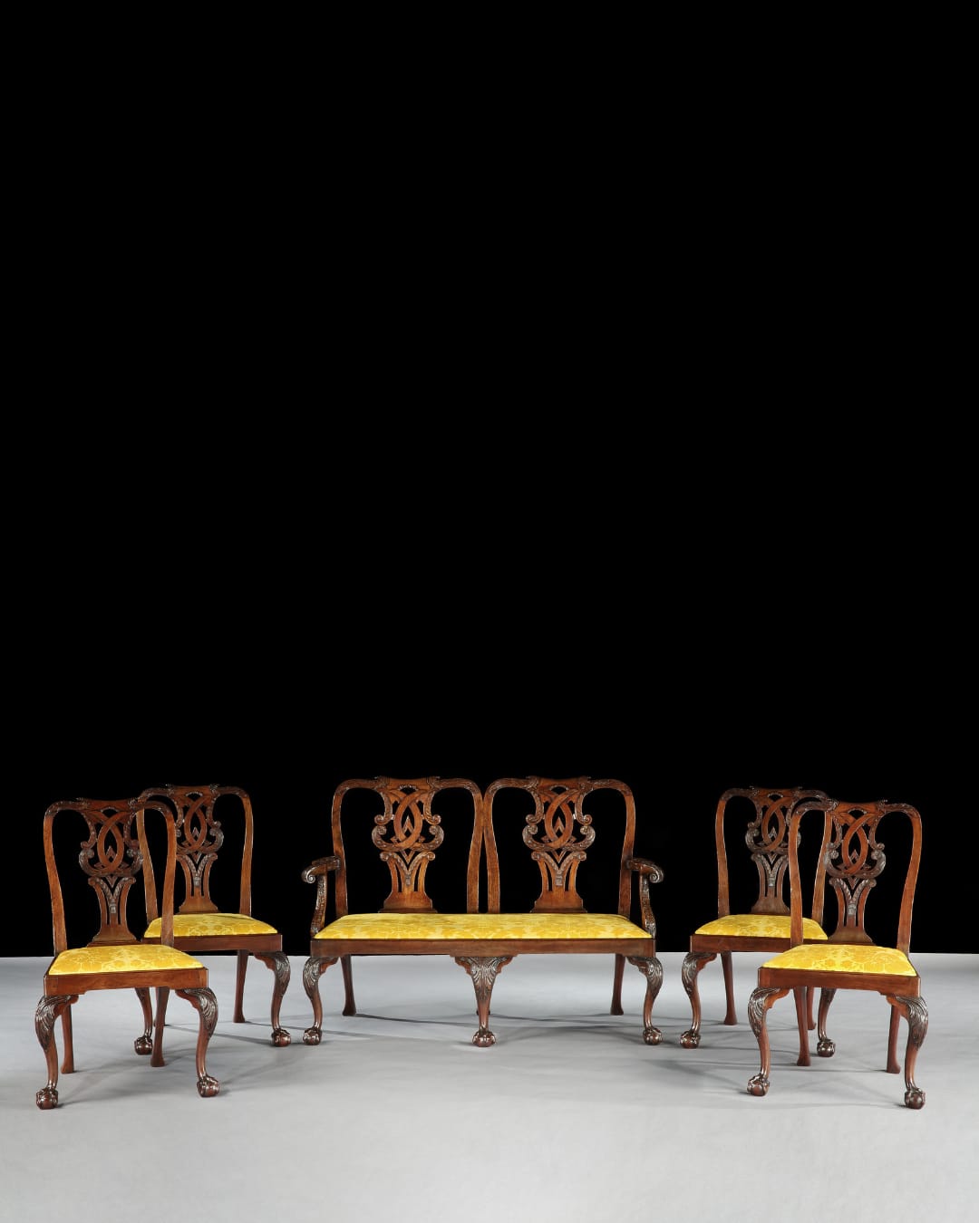 A SUITE OF GEORGE II SIDE CHAIRS WITH SETTEE, English, circa 1755