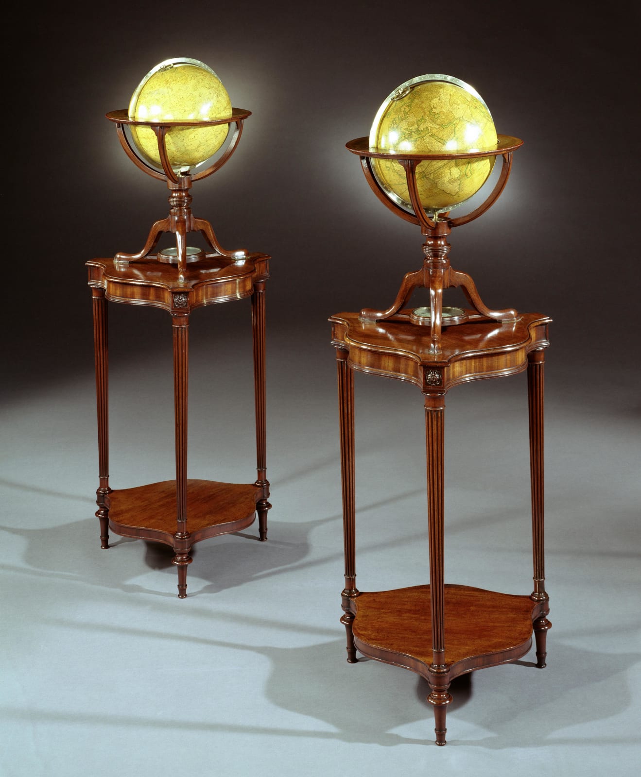 A PAIR OF GEORGE III GLOBES BY DUDLEY ADAMS, The terrestrial globe 1816  The celestial globe dated 1811  The stands English, circa 1800