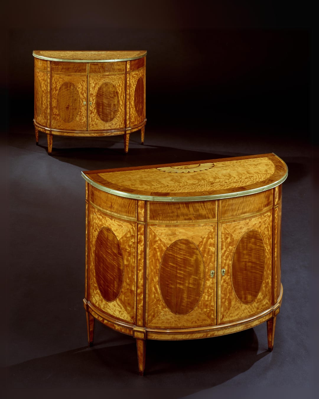 A PAIR OF GEORGE III SATINWOOD COMMODES, English, circa 1785