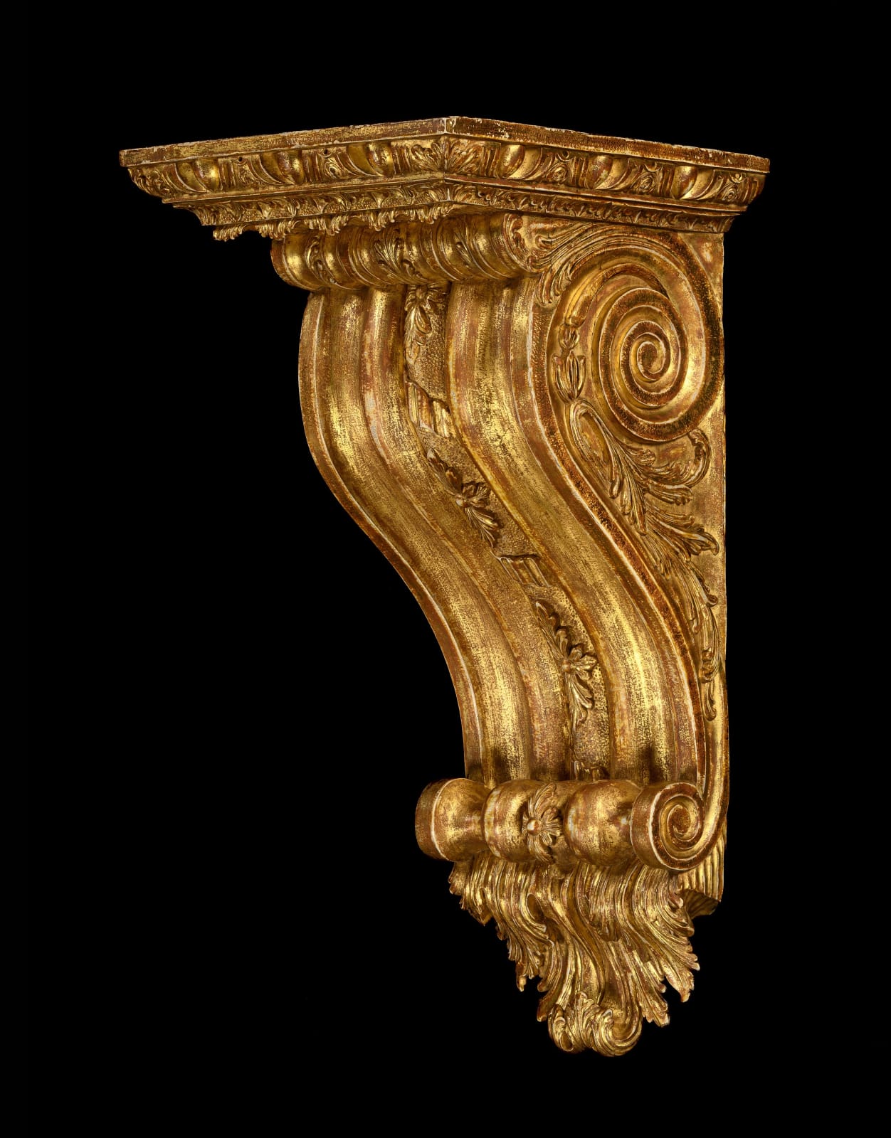 A GEORGE II GILTWOOD BRACKET IN THE MANNER OF WILLIAM KENT, English, circa 1740