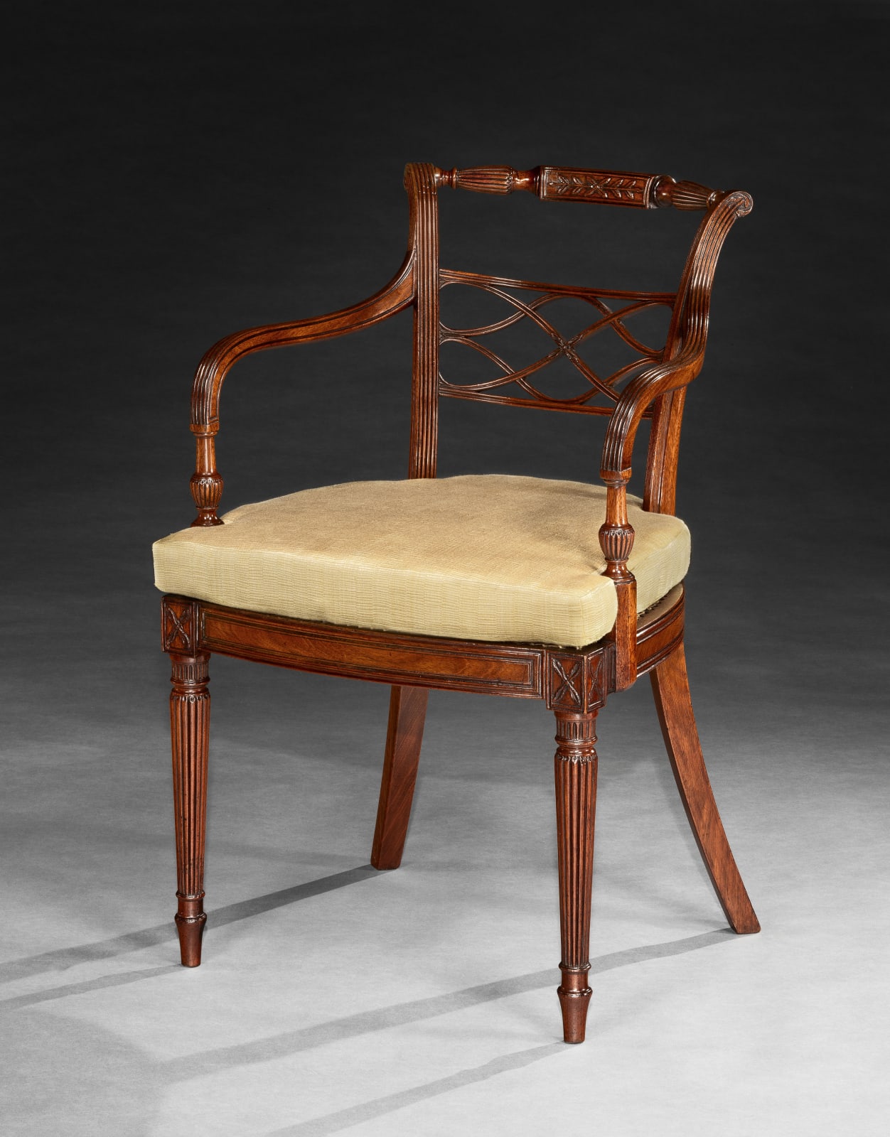 A SET OF EIGHT GEORGE III MAHOGANY ARMCHAIRS, English, circa 1790