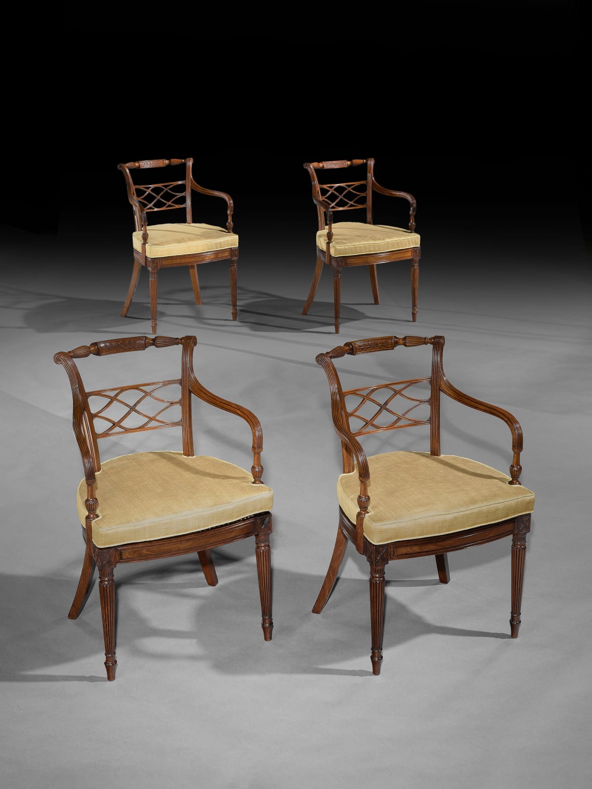 A SET OF EIGHT GEORGE III MAHOGANY ARMCHAIRS, English, circa 1790