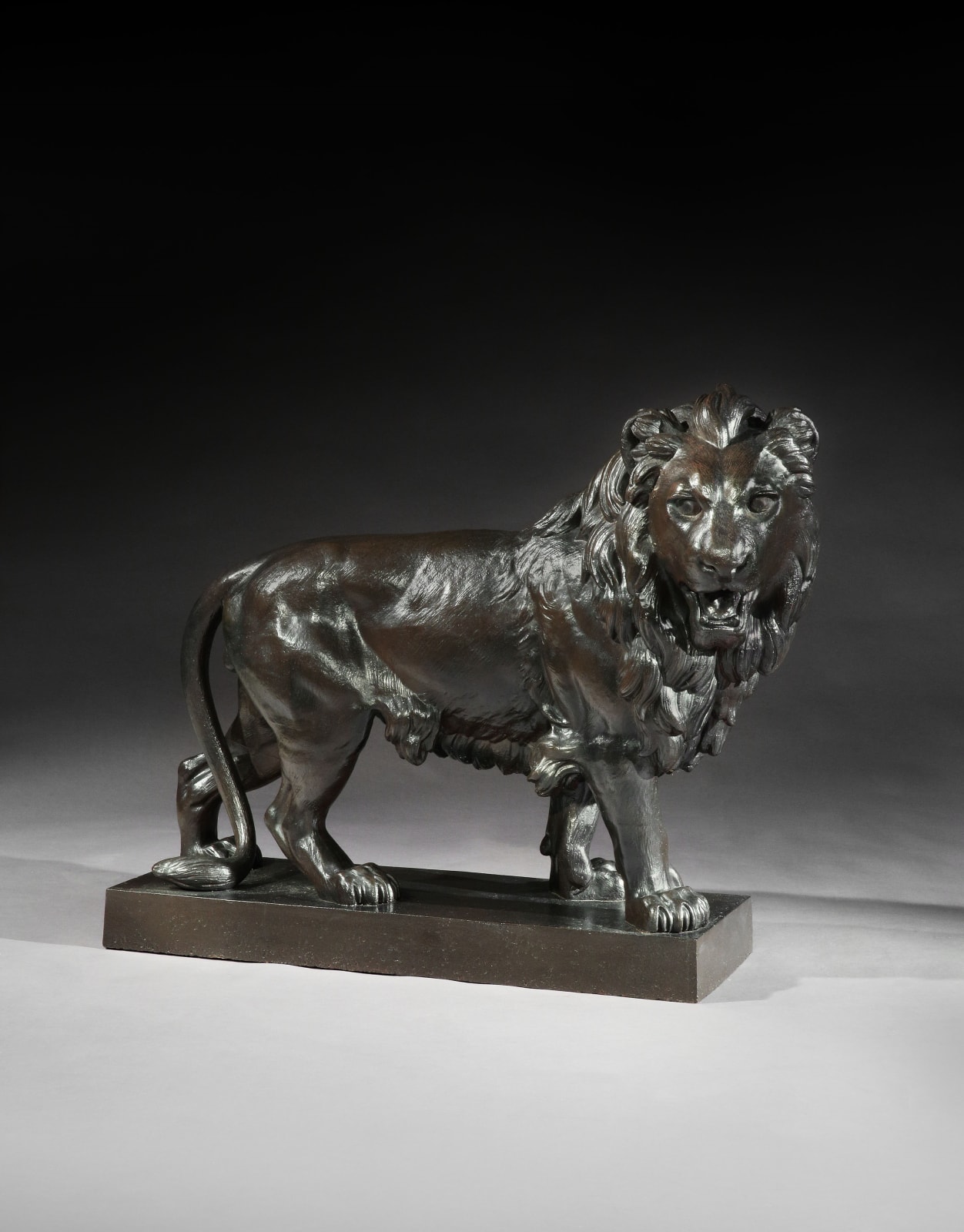 A PAIR OF SECOND EMPIRE CAST IRON LIONS , French, circa 1860
