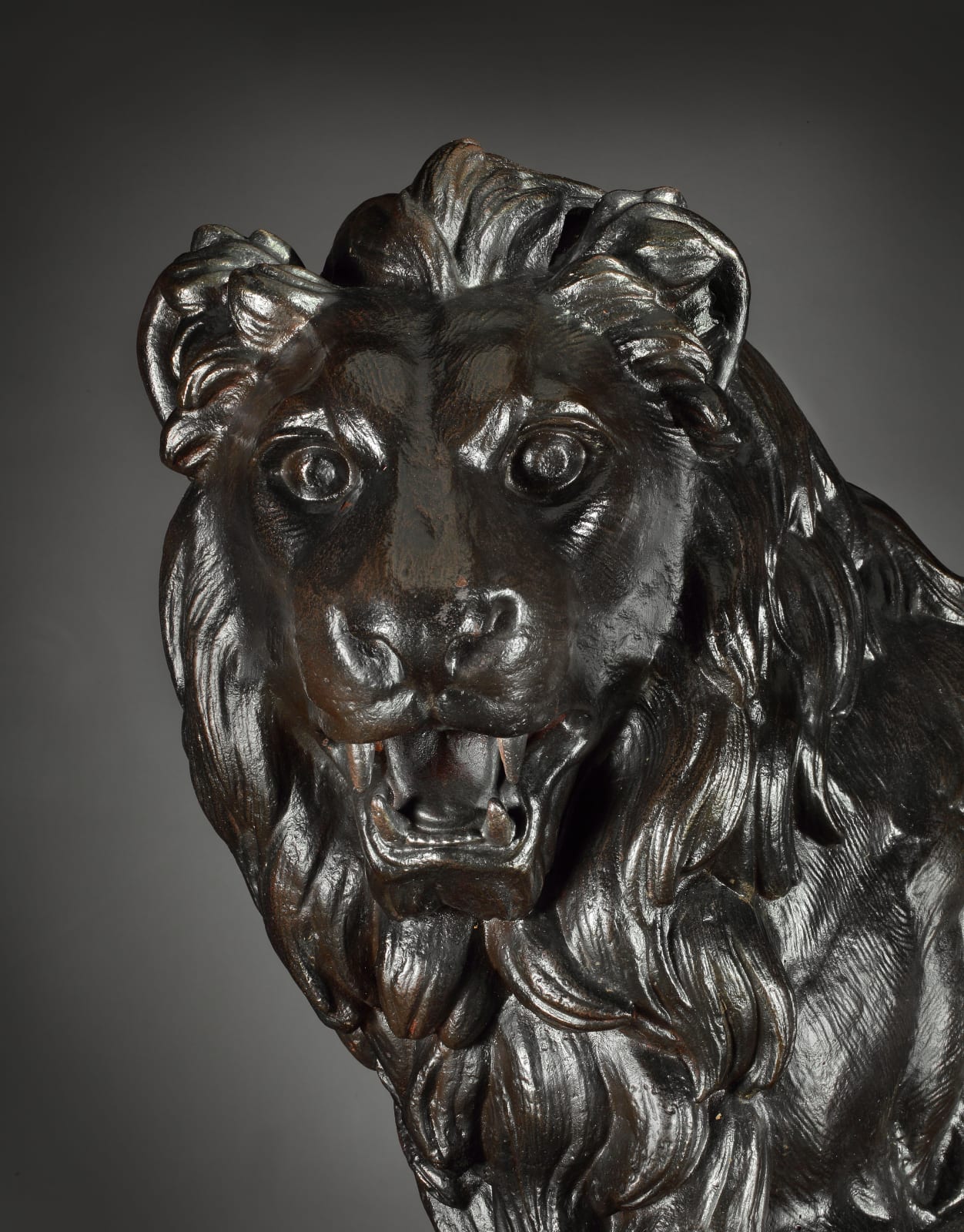 A PAIR OF SECOND EMPIRE CAST IRON LIONS , French, circa 1860