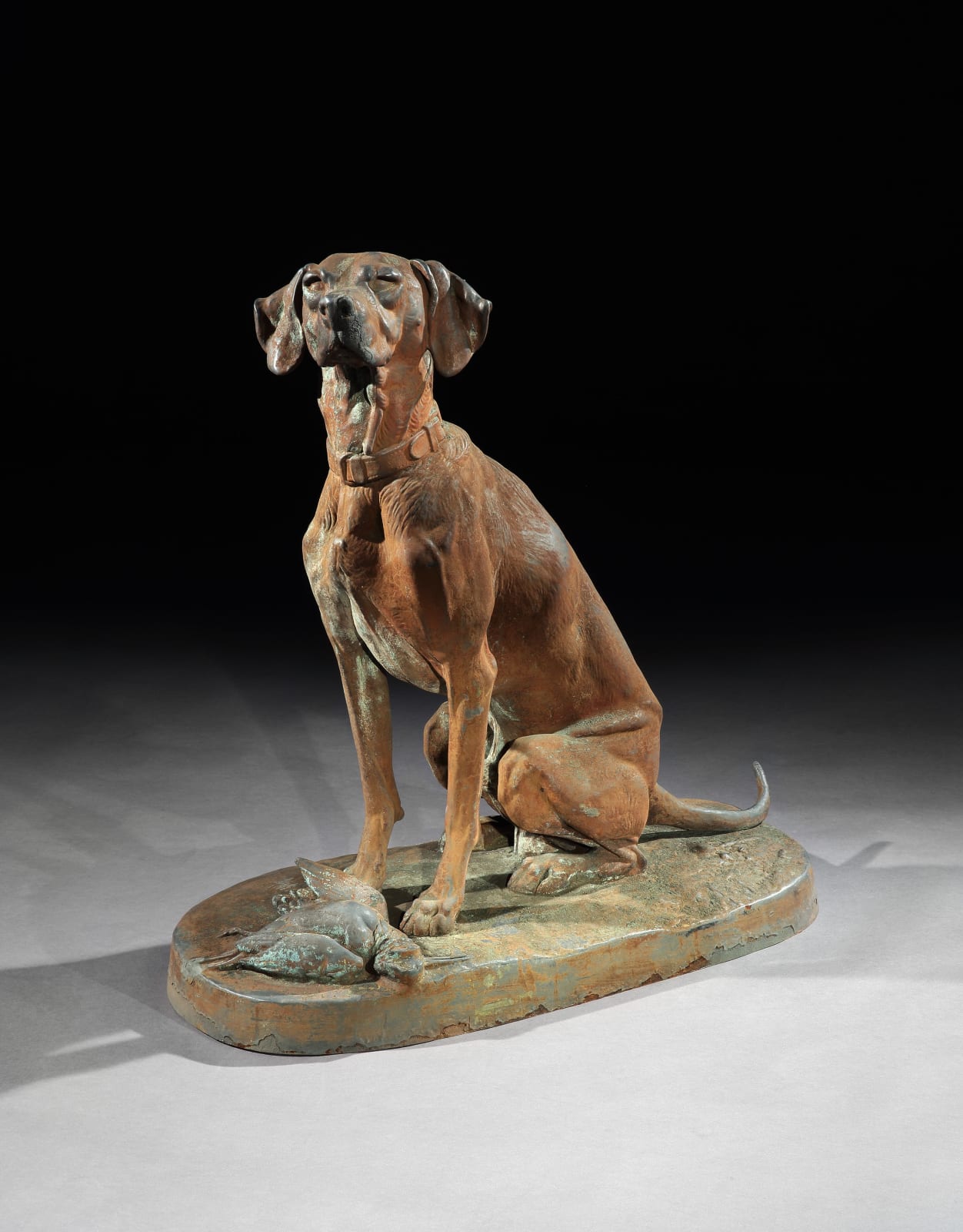 A PAIR OF SECOND EMPIRE CAST IRON SEATED HOUNDS , French, circa 1870