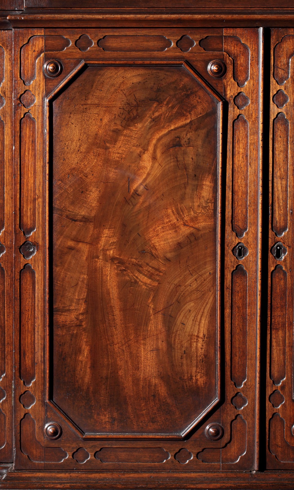A GEORGE II MAHOGANY BREAKFRONT BOOKCASE, English, circa 1755