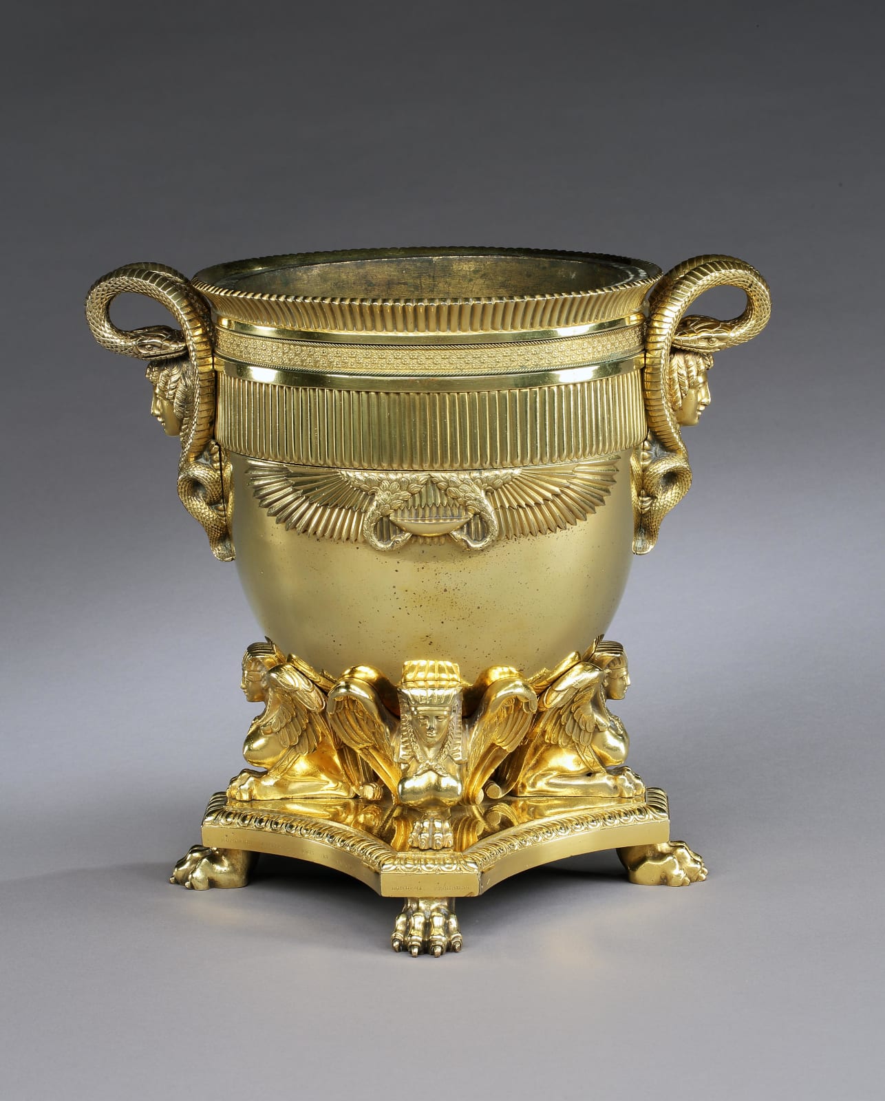 A PAIR OF GEORGE III GILT BRONZE WINE COOLERS, English, circa 1805