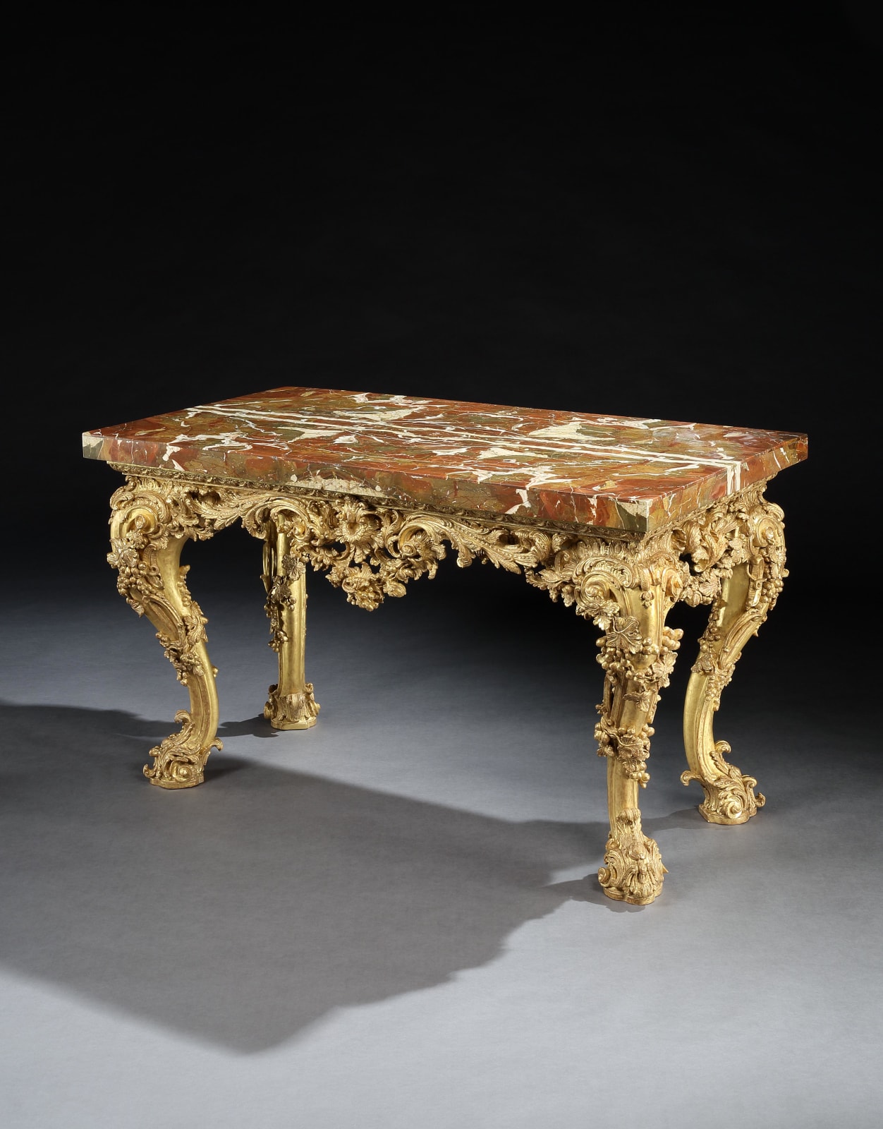 A GEORGE II GILTWOOD SIDE TABLE , The table base: English, circa 1755  The jasper top: English, circa 1730