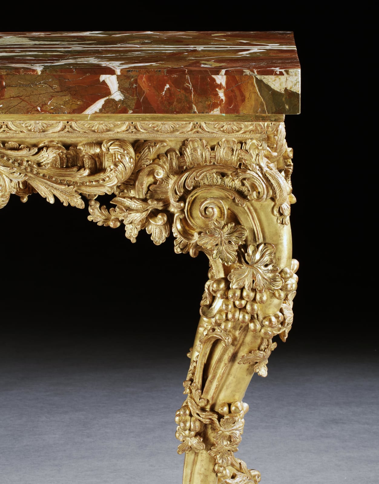 A GEORGE II GILTWOOD SIDE TABLE , The table base: English, circa 1755  The jasper top: English, circa 1730