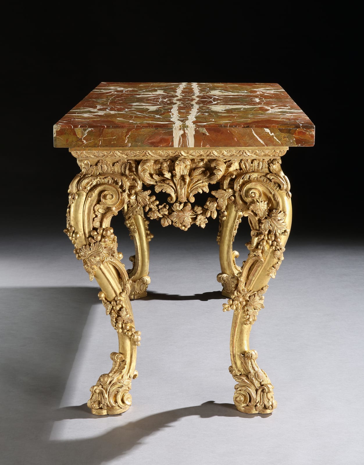 A GEORGE II GILTWOOD SIDE TABLE , The table base: English, circa 1755  The jasper top: English, circa 1730