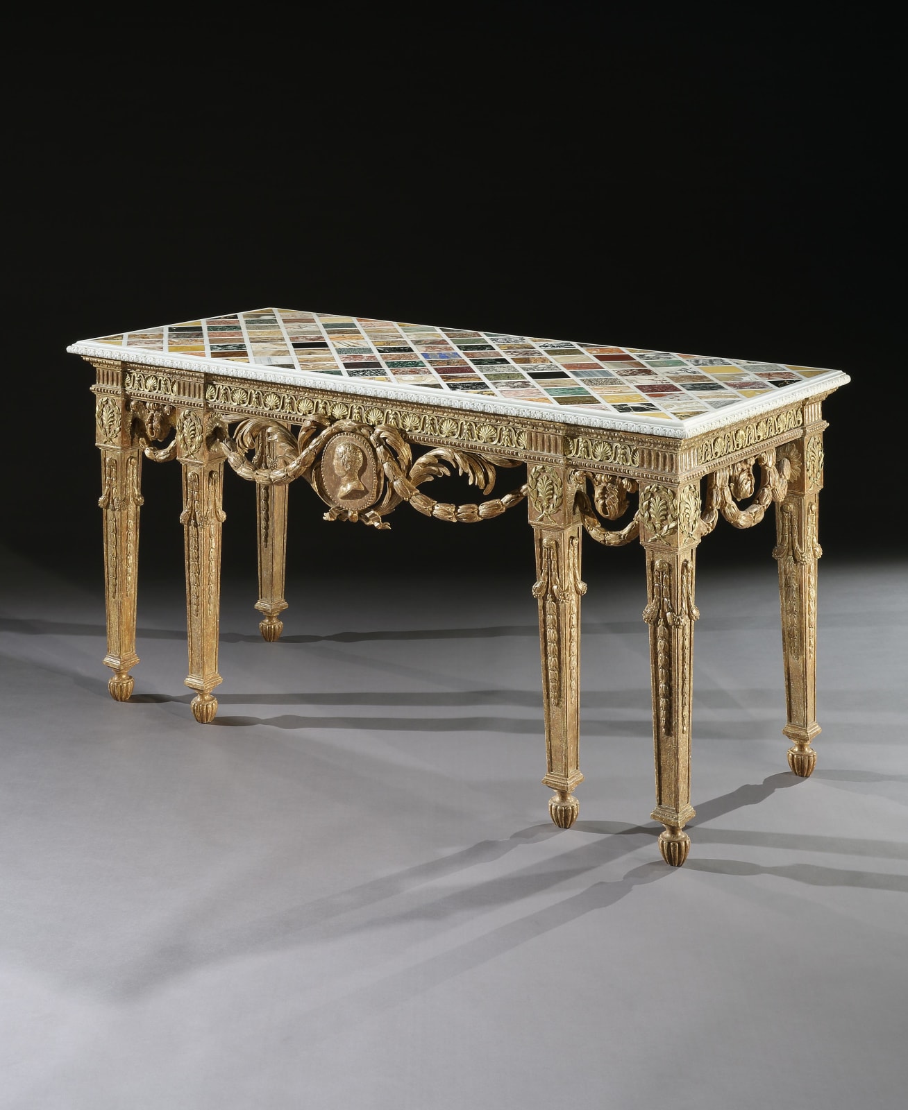 THE DAISY FELLOWES SPECIMEN MARBLE TABLE, The specimen marble top: Roman, circa 1750  The giltwood base: English, circa 1765