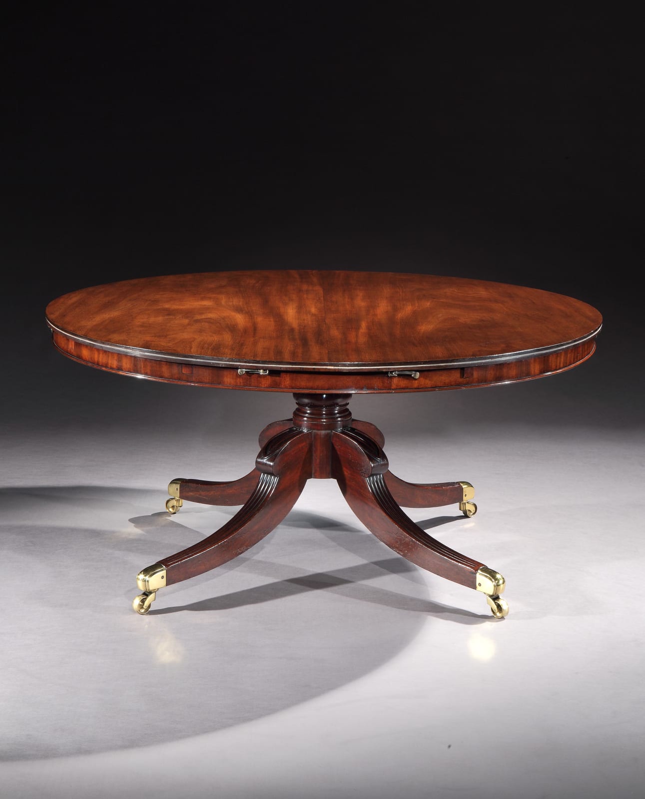 A REGENCY MAHOGANY EXTENDING DINING TABLE, English, circa 1815