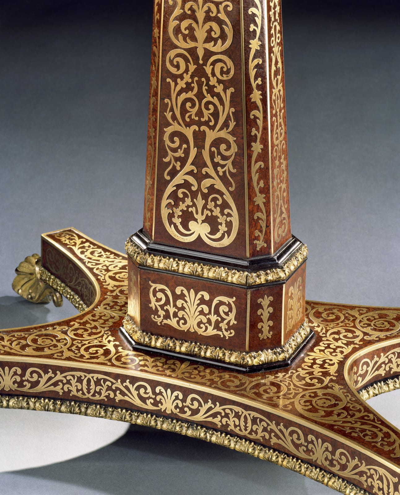 A REGENCY AMBOYNA BRASS INLAID CENTRE TABLE, English, circa 1815