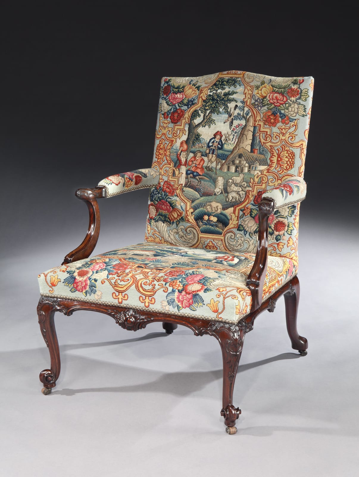 A PAIR OF GEORGE III MAHOGANY NEEDLEWORK LIBRARY ARMCHAIRS , Chairs: English, circa 1760  Needlework: English, circa 1740