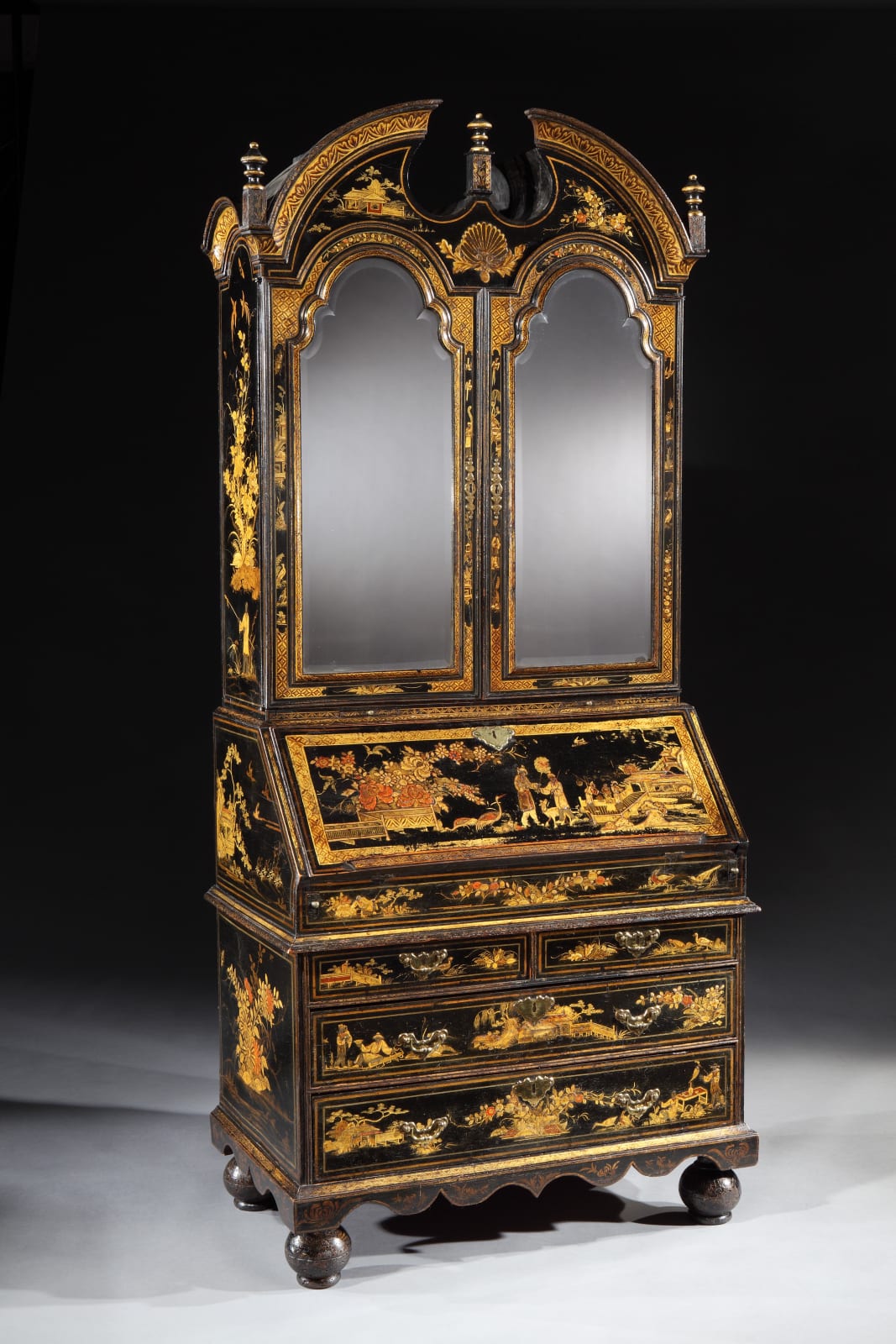 A QUEEN ANNE BLACK JAPANNED BUREAU CABINET, English, circa 1710