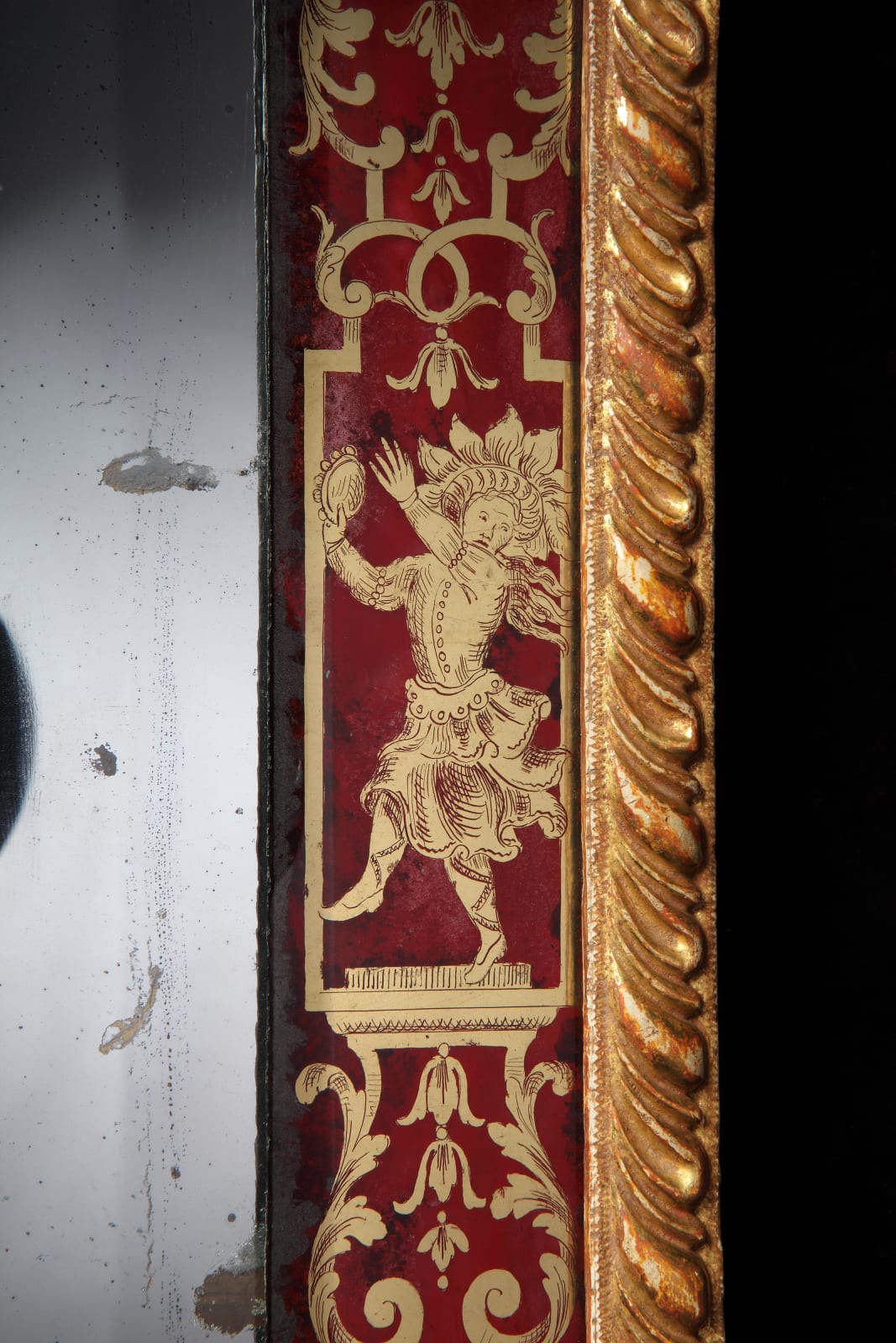 A QUEEN ANNE VERRE ÉGLOMISÉ BORDER GLASS MIRROR, English, circa 1705