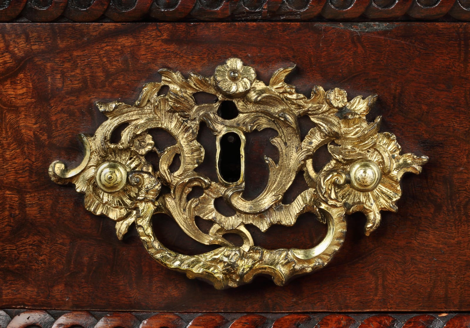 A GEORGE II QUILTED MAHOGANY COMMODE, English, circa 1750