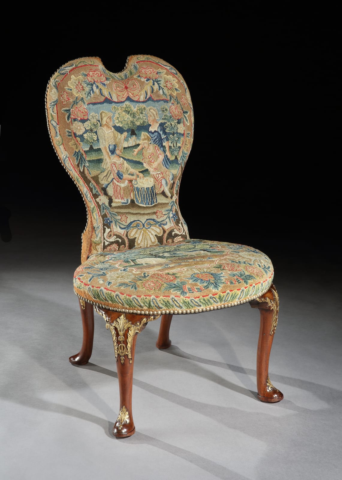 A PAIR OF GEORGE II CHAIRS ATTRIBUTED TO PETER ALEXANDER, The chairs: English, circa 1735  The needlework: English, circa 1735