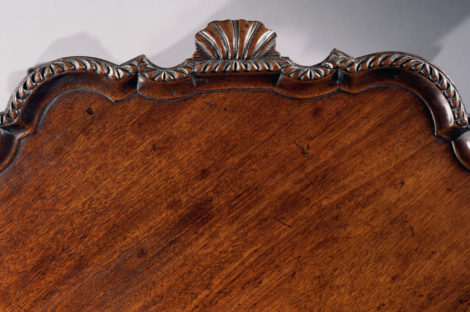A GEORGE II CARVED MAHOGANY TRIPOD TABLE, English, circa 1765