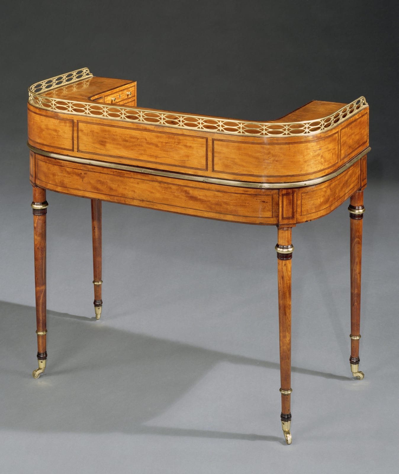 A GEORGE III SATINWOOD CARLTON HOUSE WRITING TABLE, English, circa 1790