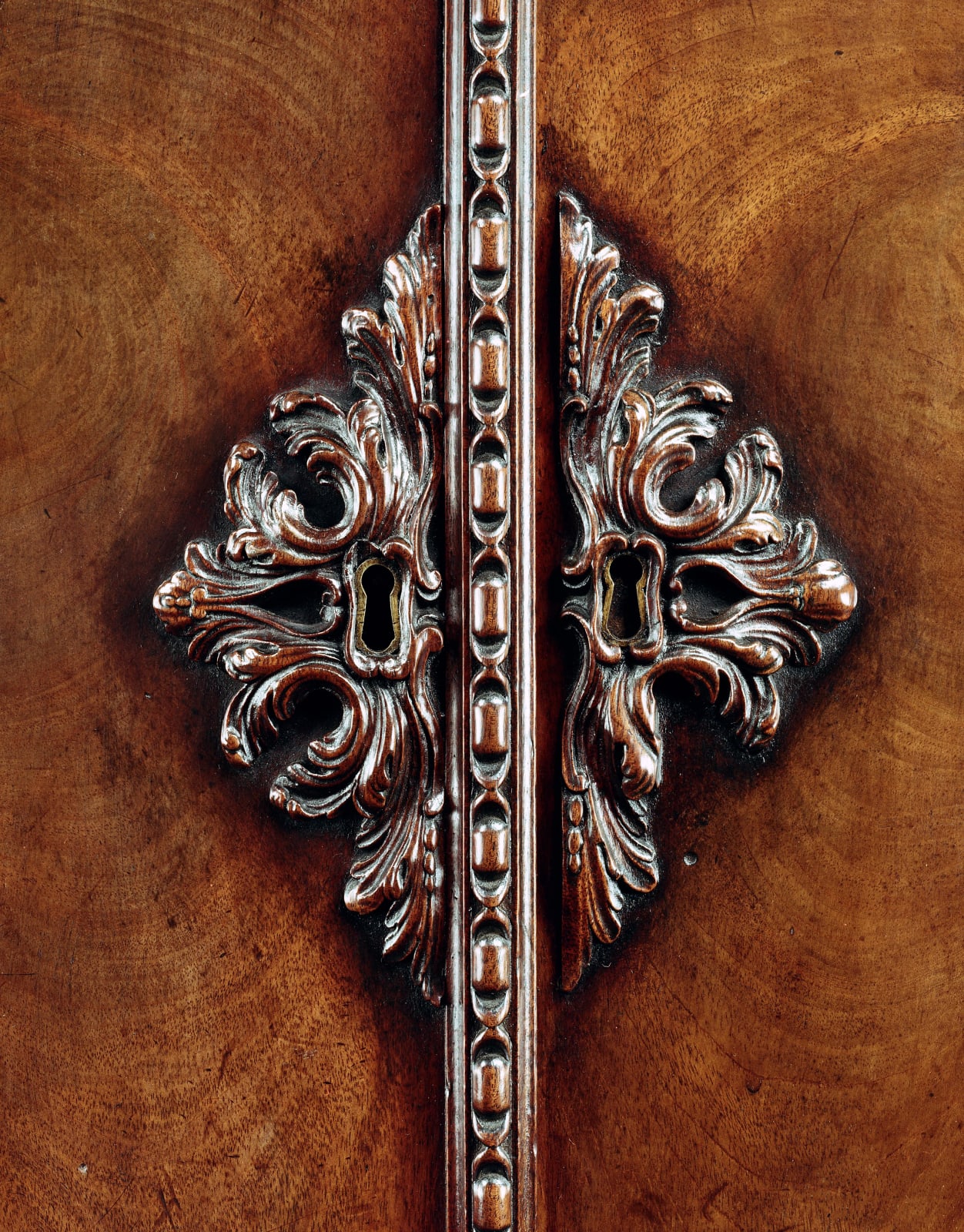 A MAHOGANY COMMODE ATTRIBUTED TO JOHN BRADBURN, English, circa 1765